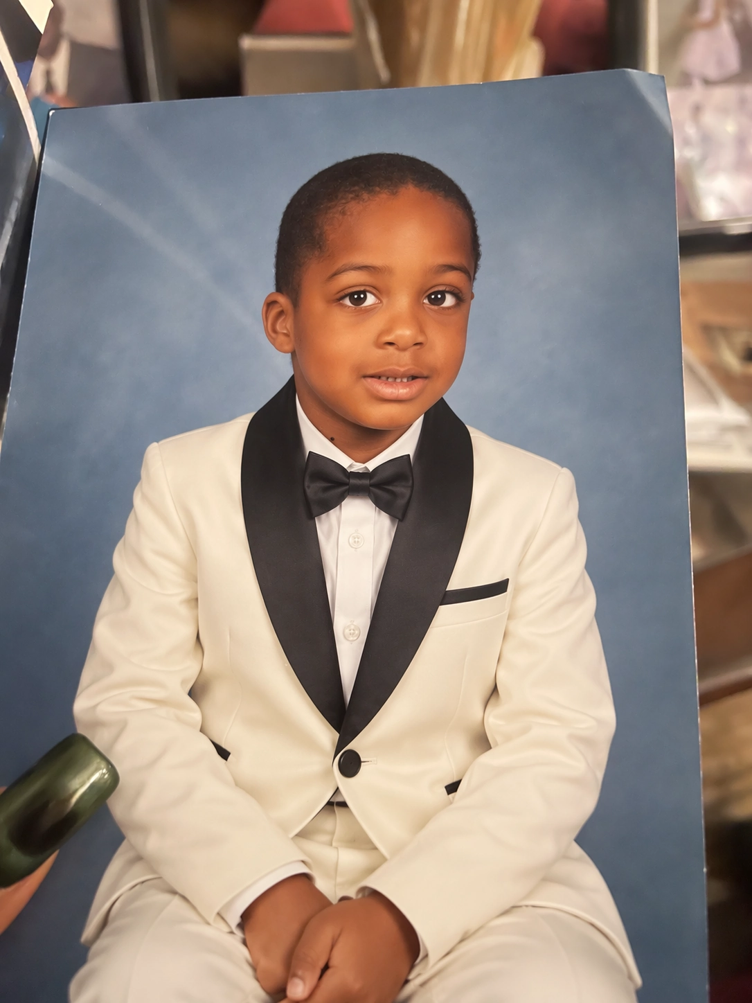 OpenAI example output: the same portrait edited to show a tuxedo